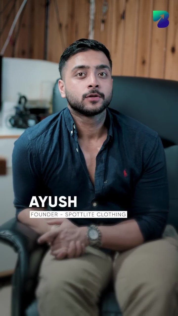 Ayush, founder of Spottlite Clothing, speaking to camera in his office
